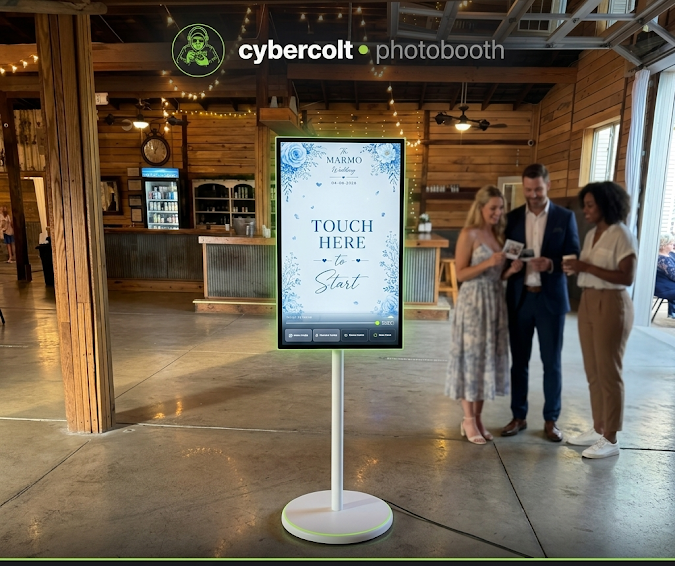CyberColt open-air photobooth — a freestanding touchscreen pedestal set up at an event venue